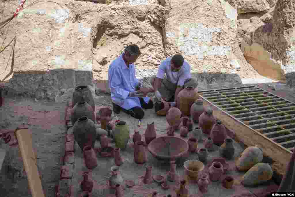 Egyptian archaeological worker restores pottery in Luxor, Egypt, Sept. 9, 2017. 