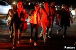 People walk on the street during a blackout in Caracas, Venezuela, March 7, 2019.