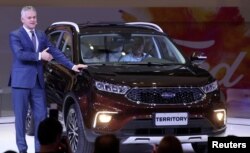 FILE - Lyle Watters, Vice President at Ford Motor Company and President of Ford South America, presents the Territory during the media day of the Salao do Automovel Auto Show in Sao Paulo, Brazil, Nov. 6, 2018.