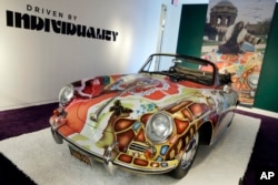 Singer Janis Joplin's painted 1964 Porsche 356C Cabriolet car for sale at Sotheby's in New York, Dec. 4, 2015.