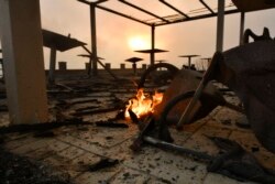 A burned hotel during a wildfire in Lalas village, near Olympia town, western Greece, Aug. 5, 2021. Wildfires rekindled outside Athens and forced more evacuations around southern Greece as weather worsened.