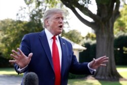 FILE - President Donald Trump speaks with reporters on the South Lawn of the White House, in Washington, Sept. 16, 2019.