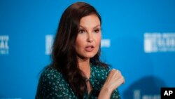 Kansas City Chiefs head coach Andy Reid, left, his wife Tammy Reid, center, and quarterback Patrick Mahomes celebrate after the Chiefs defeated the San Francisco 49ers in the NFL Super Bowl 54.