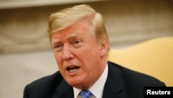 President Donald Trump speaks in the Oval Office at the White House in Washington, July 2, 2018. 