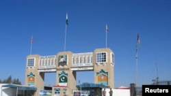 Paramilitary soldiers stand by the closed Friendship Gate crossing point at the Pakistan-Afghanistan border town of Chaman, as a preventive measure following the coronavirus outbreak, March 2, 2020.