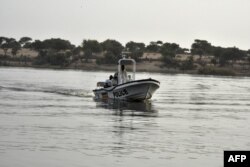 FILE - A boat of the Chadian police sailing on Lake Chad.