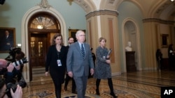 Senate Majority Leader Mitch McConnell of Ky., departs the Senate chamber, on Capitol Hill, Feb. 3, 2020 in Washington. 