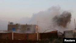 Smoke rises after what activists said were clashes with Islamic State fighters in Soran Azaz, Aleppo, Syria. June 1, 2015.