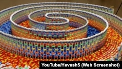 A screen shot from Hevesh5 showing the fallen dominoes from her "Amazing Triple Spiral."