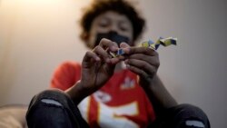 A student works on a puzzle while visiting a sensory room at French Middle School, Wednesday, Nov. 3, 2021, in Topeka, Kan. The rooms are designed to relieve stresses faced by students as they return to classrooms amid the ongoing pandemic.