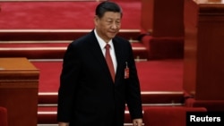 资料照片: 2024 年3月11日习近平于抵达中国北京人民大会堂出席全国人民代表大会闭幕会议