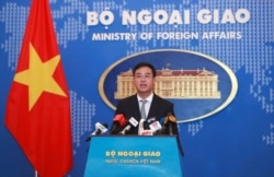 FILE - Vietnamese Ministry of Foreign Affairs deputy spokesperson Ngo Toan Thang speaks to media in Hanoi, Vietnam, Nov. 7, 2019.