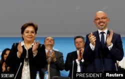 COP 24 President Michal Kurtyka and Executive Secretary of the UN Framework Convention on Climate Change Patricia Espinosa react after adopting the final agreement during a closing session of the COP24 U.N. Climate Change Conference 2018 in Katowice, Poland.