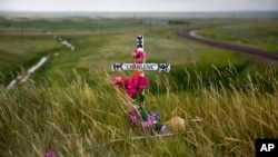 A makeshift memorial stands near the scene where Charlene Mancha was killed by her husband last year on the Blackfeet Indian Reservation in Browning, Mont., July 14, 2018. Thomas Edward Mancha pleaded guilty of second-degree murder in her death.