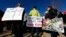 Supporters hold up a placard during a rally in for Jeanette Vizguerra, a Mexican woman seeking to avoid deportation from the United States, outside the Immigration and Customs Enforcement office in Centennial, Colo. 