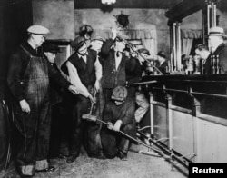 U.S. Prohibition agents destroy a bar in an undated photo held by the National Archives and Records Administration.
