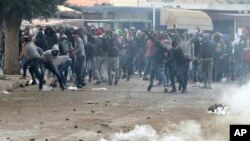 Demonstrators take the streets during anti-government protests, in Tebourba, south of the Tunisian capital, Tunis, Jan. 9, 2018.