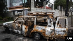 FILE - The remains of a burnt car which was set on fire by a mob during the violence after the assassination of Oromo's pop singer Hachalu Hundessa is seen in Shashamene, Ethiopia, July 12, 2020.