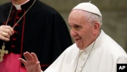 FILE - Pope Francis greets faithful during his weekly general audience, in the Pope Paul VI hall, at the Vatican, Jan. 18, 2017. 