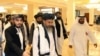 FILE - In this Sept. 12, 2020 photo, a Taliban delegation arrive to attend the opening session of the peace talks between the Afghan government and the Taliban in Doha, Qatar.