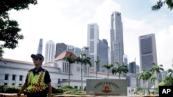 Police patrol the area surrounding Singapore's Parliament House, Jan. 15, 2016.