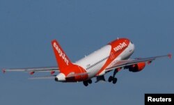 FILE PHOTO: A Easy Jet Airbus A319-100 plane takes off from the Nantes-Atlantique airport in Bouguenais near Nantes, France, Feb. 12, 2019.