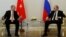 Turkish President Recep Tayyip Erdogan speaks to Russian President Vladimir Putin (R) during their meeting in St. Petersburg, Russia, August 9, 2016. 