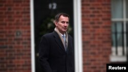 FILE - Britain's Foreign Secretary Jeremy Hunt arrives in Downing Street, London, Britain, Dec. 18, 2018.