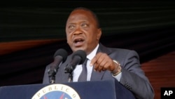 FILE - Kenyan President Uhuru Kenyatta speaks during Jamhuri Day celebrations (Independence Day) at Nyayo Stadium in Nairobi, Dec. 12, 2016. Kenyatta says his Jubilee Party will hold new primary voting April 24-25, 2017.