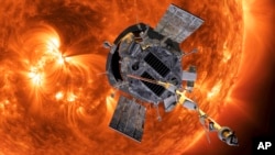 This image made available by NASA shows an artist's rendering of the Parker Solar Probe approaching the Sun. (Steve Gribben/Johns Hopkins APL/NASA via AP)