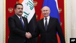 블라디미르 푸틴(오른쪽) 러시아 대통령과 모하메드 알수다니 이라크 총리가 10일 모스크바에서 회동하고 있다.