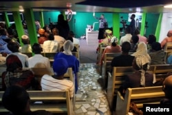 Ahmad Isah, the host of Nigeria's "Brekete Family" radio program, speaks to his audience at Human Rights Radio in Abuja, Nigeria, June 26, 2018.