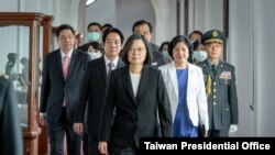 Taiwanese President Tsai Ing-wen, center, walks ahead of Vice-President Lai Ching-te, left of her, as they attend an inauguration ceremony in Taipei, Taiwan, Wednesday, May 20, 2020. 