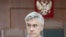 FILE - U.S. investor and founder of the Baring Vostok private equity group Michael Calvey, who is under house arrest on suspicion of fraud, attends a court hearing in Moscow, Russia, Aug. 15, 2019.