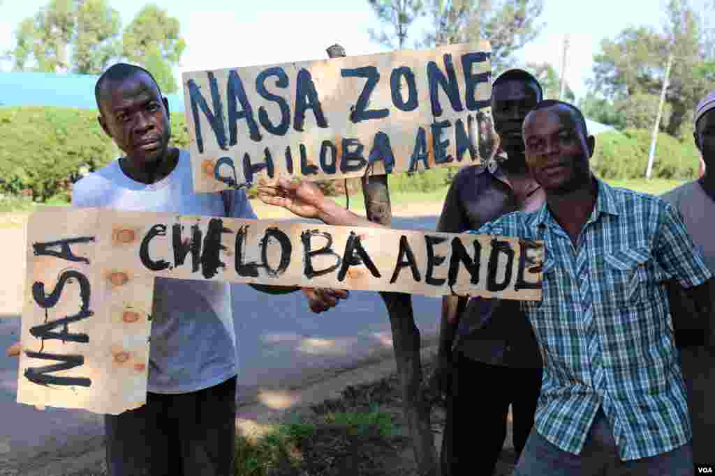Mechanics in Vihiga county, Kenya, display signs they made in support of opposition candidate Raila Odinga and his NASA coalition ahead of the upcoming re-run presidential election. October 6, 2017. (VOA/J. Craig)