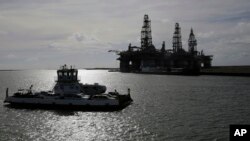 In preparation for Hurricane Harvey, Aug, 24, 2017, oil platforms were parked after a mandatory evacuation was ordered. With Tropical Storm Nate forecast to hit the Gulf Coast, similar plans are underway.