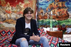 Museum owner Cristian Lica poses for a picture inside the newly opened Kitsch Museum in Bucharest, Romania, May 4, 2017.