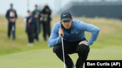Rory McIlroy, of Northern Ireland, saw a fan come out of the stands during a Ryder Cup practice round a make a big putt.