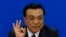 China's Premier Li Keqiang gestures as he speaks during a news conference, after the closing ceremony of the Chinese National People's Congress (NPC) at the Great Hall of the People, in Beijing, March 13, 2014.
