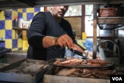 Vangelis Stilianou owns a restaurant in Skala Sikamineas with his brother. Like many others in Lesvos, he has been badly affected by the drop in tourism. (J. Owens/VOA)