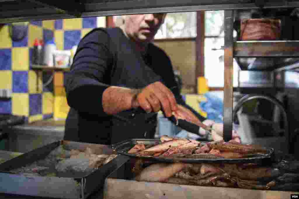 Vangelis Stilianou owns a restaurant in Skala Sikamineas with his brother. Like many others in Lesvos, he has been badly affected by the drop in tourism. (J. Owens/VOA)