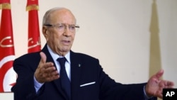 FILE - Tunisian President Beji Caid Essebsi says he and other former officials of the Zine El-Abidine Ben Ali regime are technocrats untainted by past abuses.