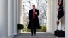 FILE - President Donald Trump waves as he walks through the Colonnade from the Oval Office of the White House, Jan. 25, 2019.