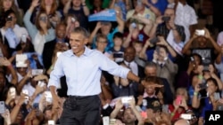 President Barack Obama arrives at a rally in North Las Vegas, Nev., Oct. 23, 2016.