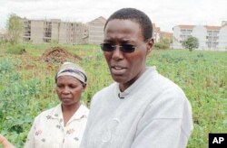Mary Njenga, of Kenya’s Urban Harvest NGO, with some of Nairobi’s city farmers on their land near Kibera slum