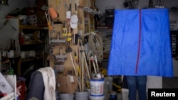 FILE - A voter casts his ballot during the U.S. presidential election in Philadelphia, Pennsylvania, Nov. 8, 2016.
