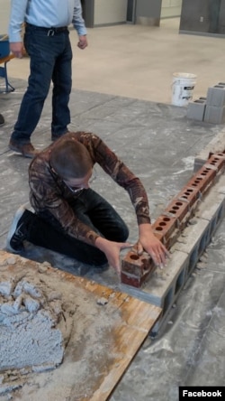 High school students from the Waterloo Community School District take part in construction traning at their school. The students spent five days at their school learning from experienced workers from the Masonry Institute of Iowa. (Masonry Institute of Io