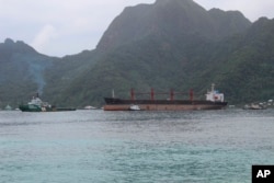The North Korean cargo ship, Wise Honest, middle, was towed into the Port of Pago Pago, May 11, 2019, in Pago Pago, American Samoa.