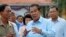 FILE: Cambodian Prime Minister Hun Sen, center, of ruling Cambodian People's Party speaks after his voting in the senate election at Takhmau polling station in Kandal province, southeast of Phnom Penh, Cambodia, Sunday, Feb. 25, 2018.