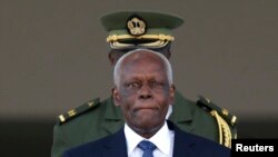 FILE - Angolan President Jose Eduardo dos Santos leaves the Planalto Palace after a meeting with Brazil's President Dilma Rousseff in Brasilia, June 16, 2014. 